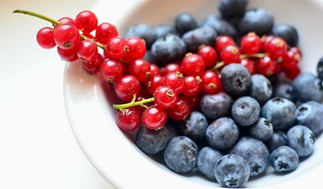 The plate is filled with black currant - black currant benefits